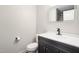 Bathroom with sleek vanity, modern black faucet, and contemporary lighting at 1287 Schaub Dr # J, Raleigh, NC 27606