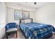 Well-lit bedroom features a bed, window, chair, and closet at 1287 Schaub Dr # J, Raleigh, NC 27606