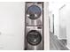 Stacked washer and dryer in the laundry closet at 1287 Schaub Dr # J, Raleigh, NC 27606