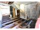 Shows a staircase under repair in this gutted home with insulation showing in the walls and floor at 1404 Gearwood Ave, Durham, NC 27701