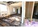Shows a gutted room with exposed floorboards, insulation, and a window in one of the walls at 1404 Gearwood Ave, Durham, NC 27701