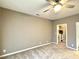 Bedroom with neutral walls, plush carpeting, and open doorway to closet at 1522 Kudrow Ln, Morrisville, NC 27560