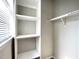 Walk-in closet with ample shelving and hanging rods at 1522 Kudrow Ln, Morrisville, NC 27560
