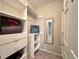 Walk-in closet with ample shelving, hanging rods, and a full-length mirror at 1522 Kudrow Ln, Morrisville, NC 27560