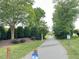 Scenic greenway trail surrounded by lush greenery and trees, perfect for walking or biking at 1522 Kudrow Ln, Morrisville, NC 27560
