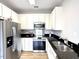Well-appointed kitchen with stainless steel appliances, granite countertops and ample cabinet space at 1522 Kudrow Ln, Morrisville, NC 27560