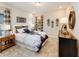 Modern bedroom with a trendy black-and-white comforter and a decorative skateboard art display at 1712 Red Roses Ave, Durham, NC 27703