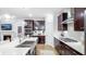 Bright kitchen with stainless steel appliances, sleek cabinetry, and a stylish island with modern lighting at 1800 Red Roses Ave, Durham, NC 27703