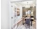Stylish home office with modern lighting, wainscoting, a decorative rug and double French doors at 1800 Red Roses Ave, Durham, NC 27703