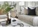 Living room with a decorative table, modern sofa, and a bright window in the background at 2204 Guess Rd, Durham, NC 27705