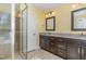 Bathroom with granite double vanity and large glass shower at 2209 Woodnell Dr, Raleigh, NC 27603