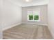 Cozy bedroom with window at 2209 Woodnell Dr, Raleigh, NC 27603