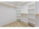 Walk-in closet with carpeting and shelving at 2209 Woodnell Dr, Raleigh, NC 27603