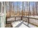 Back deck features wooden railings and a private backyard view at 2209 Woodnell Dr, Raleigh, NC 27603