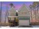 Inviting two-story home with a covered front porch and attached two-car garage at 2209 Woodnell Dr, Raleigh, NC 27603