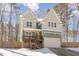 Beautiful two-story home with covered porch, a welcoming front entrance and attached garage at 2209 Woodnell Dr, Raleigh, NC 27603