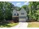 Charming two-story home with a well-manicured lawn and inviting curb appeal at 2209 Woodnell Dr, Raleigh, NC 27603