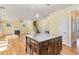 Open kitchen layout with granite island and view into living area at 2209 Woodnell Dr, Raleigh, NC 27603
