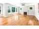 Spacious living room featuring hardwood floors, a fireplace, and abundant natural light at 2209 Woodnell Dr, Raleigh, NC 27603
