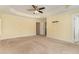 Spacious main bedroom with tray ceiling and a walk-in closet at 2209 Woodnell Dr, Raleigh, NC 27603