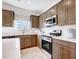 Modern kitchen features stainless steel appliances, white countertops, and plenty of cabinet space at 230 Deodora Ln, Cameron, NC 28326