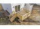 New wooden back deck with railing and stairs off sliding door at 2908 Basswood Dr, Raleigh, NC 27610