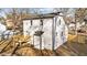 An aerial shot of a home's backyard featuring a deck, trees, and a white exterior at 2908 Basswood Dr, Raleigh, NC 27610