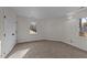 This cozy carpeted bedroom provides a window and ample closet space at 2908 Basswood Dr, Raleigh, NC 27610