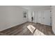 Bright bedroom with refinished floors, a window, and painted white trim at 2908 Basswood Dr, Raleigh, NC 27610