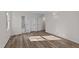 Spacious bedroom features light-colored walls and wood-look floors and a large window at 2908 Basswood Dr, Raleigh, NC 27610