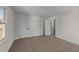 Bedroom features neutral carpet, with a window and a closet at 2908 Basswood Dr, Raleigh, NC 27610