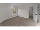 A carpeted bedroom provides a window and ample closet space at 2908 Basswood Dr, Raleigh, NC 27610