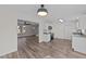 New kitchen featuring stainless steel appliances, white cabinets, and luxury vinyl plank flooring at 2908 Basswood Dr, Raleigh, NC 27610