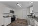 Updated kitchen includes stainless steel appliances, granite counters, and white cabinetry at 2908 Basswood Dr, Raleigh, NC 27610