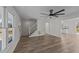 Bright living room featuring luxury vinyl plank flooring and a white staircase at 2908 Basswood Dr, Raleigh, NC 27610