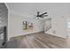 Bright living room featuring luxury vinyl plank flooring and a white staircase at 2908 Basswood Dr, Raleigh, NC 27610