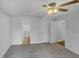 Bedroom with a ceiling fan, an ensuite bathroom, and two closets with plenty of storage space at 3300 Mossdale Ave, Durham, NC 27707