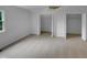 Bedroom with beige carpet, closet and two entrances at 3300 Mossdale Ave, Durham, NC 27707