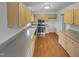 Kitchen with stainless steel appliances, wood cabinets, and laminate countertops at 3300 Mossdale Ave, Durham, NC 27707