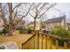 Serene backyard view from the deck, showcasing mature trees and lush landscaping at 3320 Derbyshire Pl, Raleigh, NC 27604