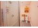 Bathroom featuring white subway tile in shower, peach walls, ceramic tile floors, and a built in vanity cabinet at 3320 Derbyshire Pl, Raleigh, NC 27604