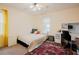 Bright bedroom with yellow curtains, neutral walls, and a patterned rug at 3320 Derbyshire Pl, Raleigh, NC 27604
