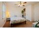 Bright bedroom with ceiling fan, neutral walls, and access to two doors at 3320 Derbyshire Pl, Raleigh, NC 27604