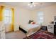 Bright bedroom with yellow curtains and cozy rug at 3320 Derbyshire Pl, Raleigh, NC 27604