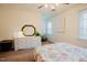 Bright bedroom features a comfortable bed, adjacent dresser, mirror and cozy nook at 3320 Derbyshire Pl, Raleigh, NC 27604