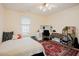 A bright bedroom with a large rug and desk at 3320 Derbyshire Pl, Raleigh, NC 27604