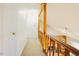 Hallway overlooking the living room with wood railing at 3320 Derbyshire Pl, Raleigh, NC 27604
