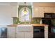 Bright kitchen with white cabinets, a farmhouse sink, butcher block counters and modern appliances at 3320 Derbyshire Pl, Raleigh, NC 27604