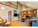 Inviting living room with hardwood floors, built-in shelves and a cozy brick fireplace at 3320 Derbyshire Pl, Raleigh, NC 27604