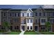 Attractive townhouse exterior with brick and siding facade, well-maintained lawn at 356 Chesapeak Commons St # 135, Garner, NC 27529